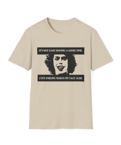 'It's not easy having a good time...even smiling makes my face ache' on a shirt in the color Sand. - Memento Mary