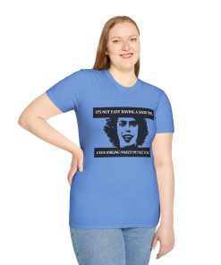 'It's not easy having a good time...even smiling makes my face ache' on a shirt in the color Carolina Blue. Memento Mary